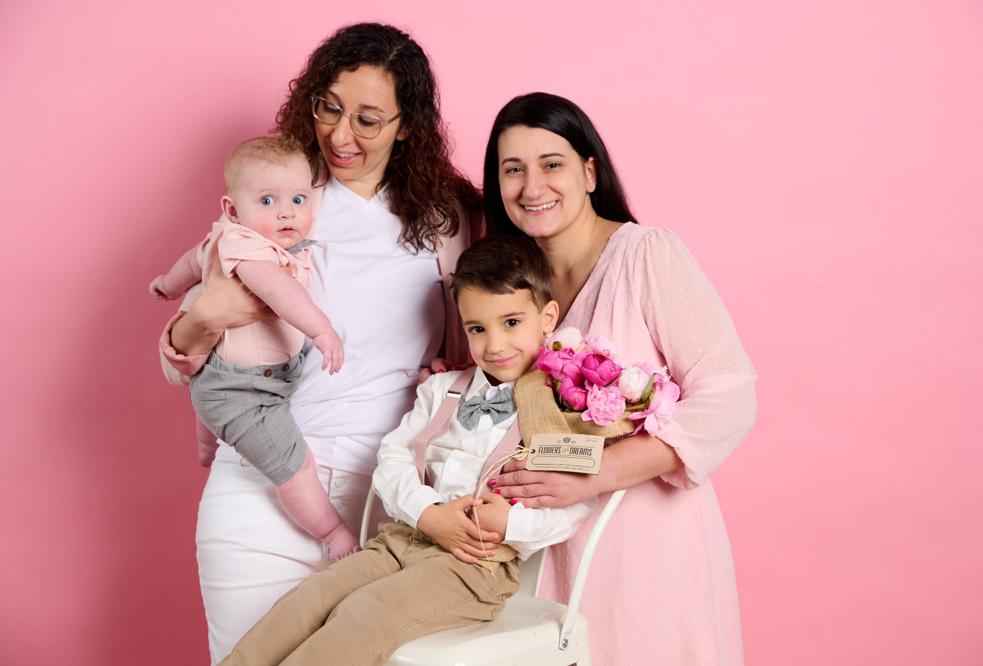 Mother’s Day joy: family with pink peony bouquet from Flowers for Dreams.