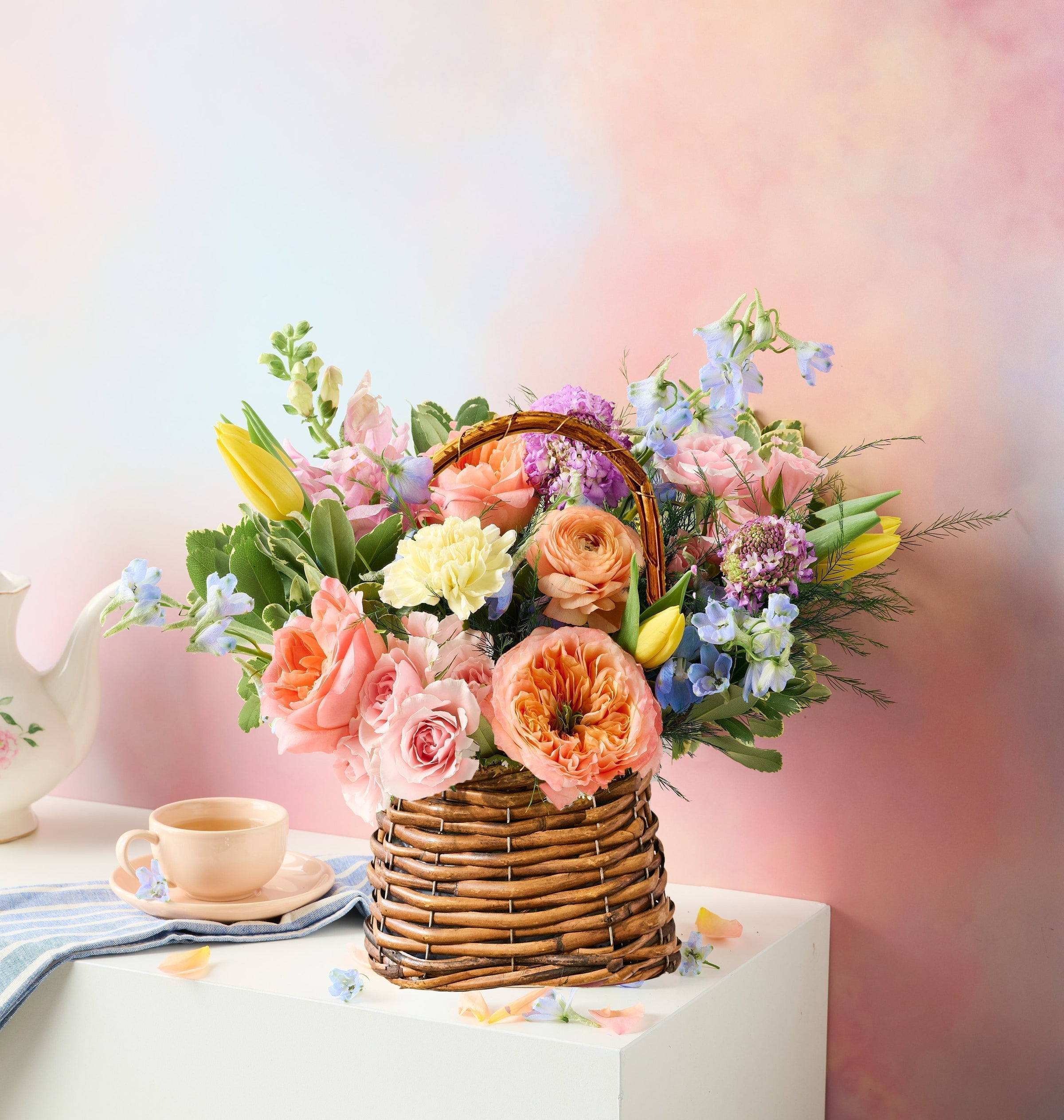 Vibrant spring Easter basket bouquet featuring colorful seasonal flowers by Flowers For Dreams.