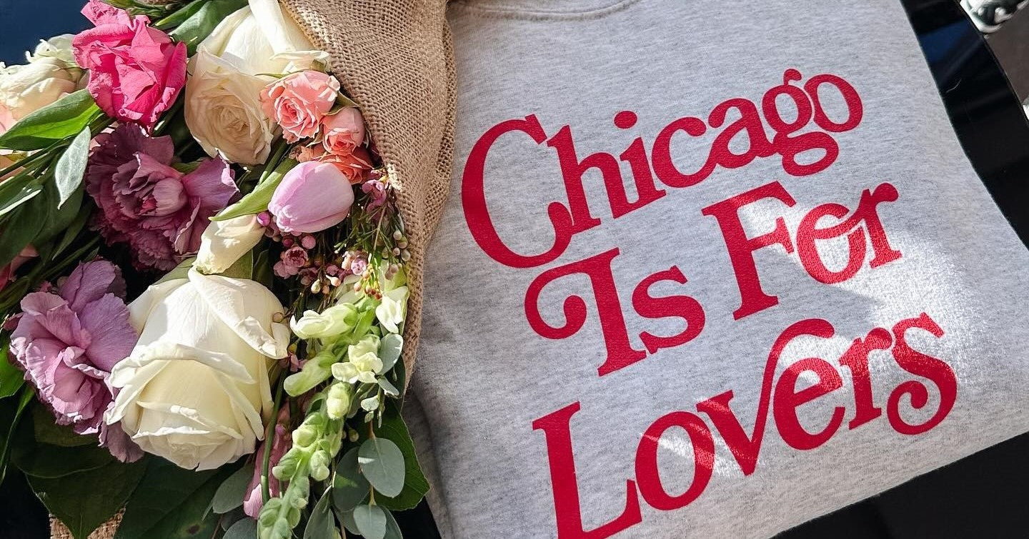 Flowers for Dreams bouquet with coffee and “Chicago Is For Lovers” tee on a cozy café table.