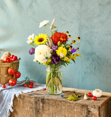 Rustic arrangement featuring fresh, sustainably grown flowers.