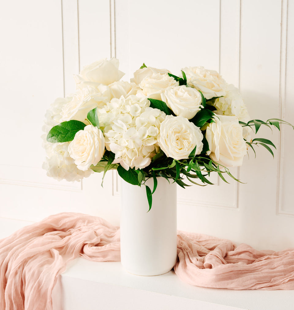 Send our Ivory bouquet of flowers to someone