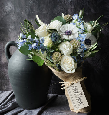 Winter Bouquet by Flowers for Dreams with white roses blue thistles and anemones