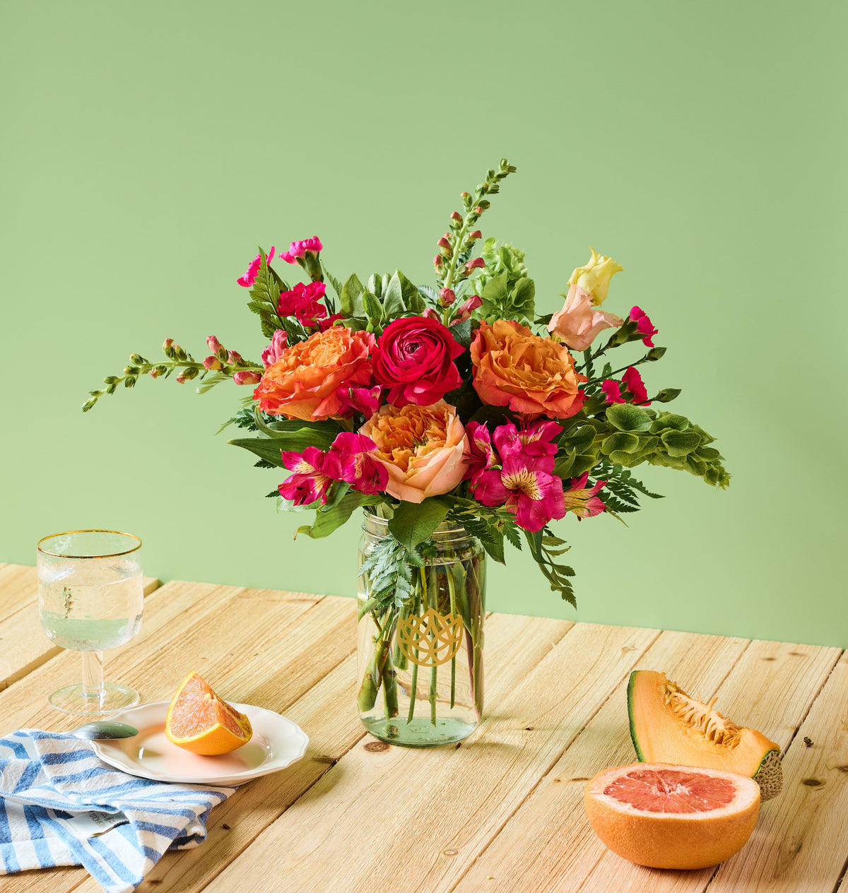 Summer flower arrangement in a ceramic vase, editorial styling