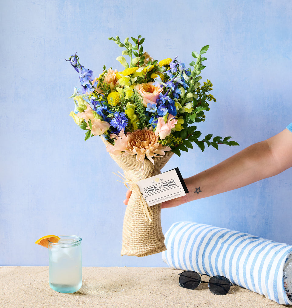 Lakeshore bouquet in a mason jar with soft blue flowers