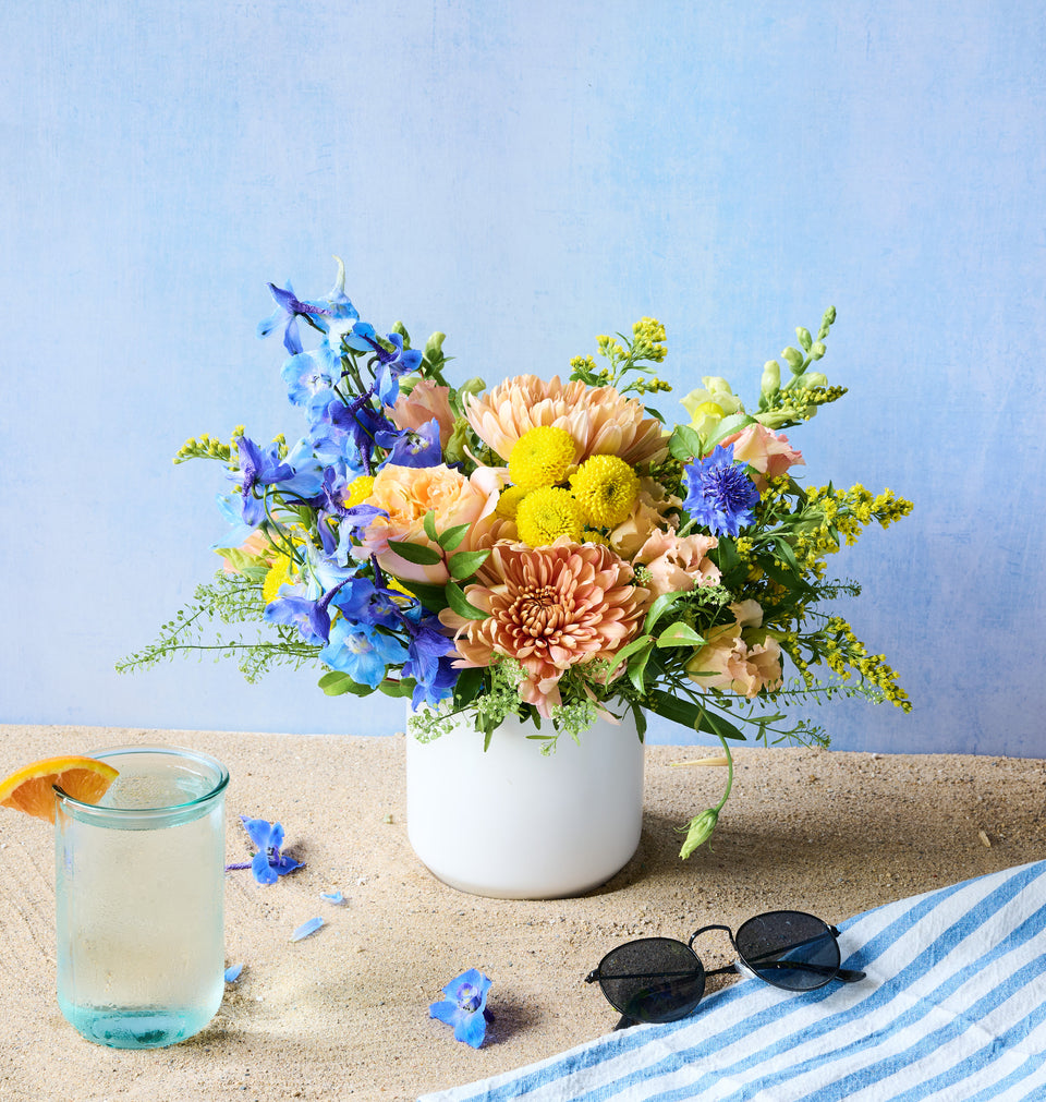 Lakeshore arrangement with mixed cool-toned blooms and greenery