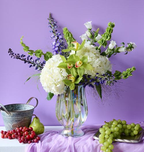 Botanica floral arrangement with lush mixed botanical blooms