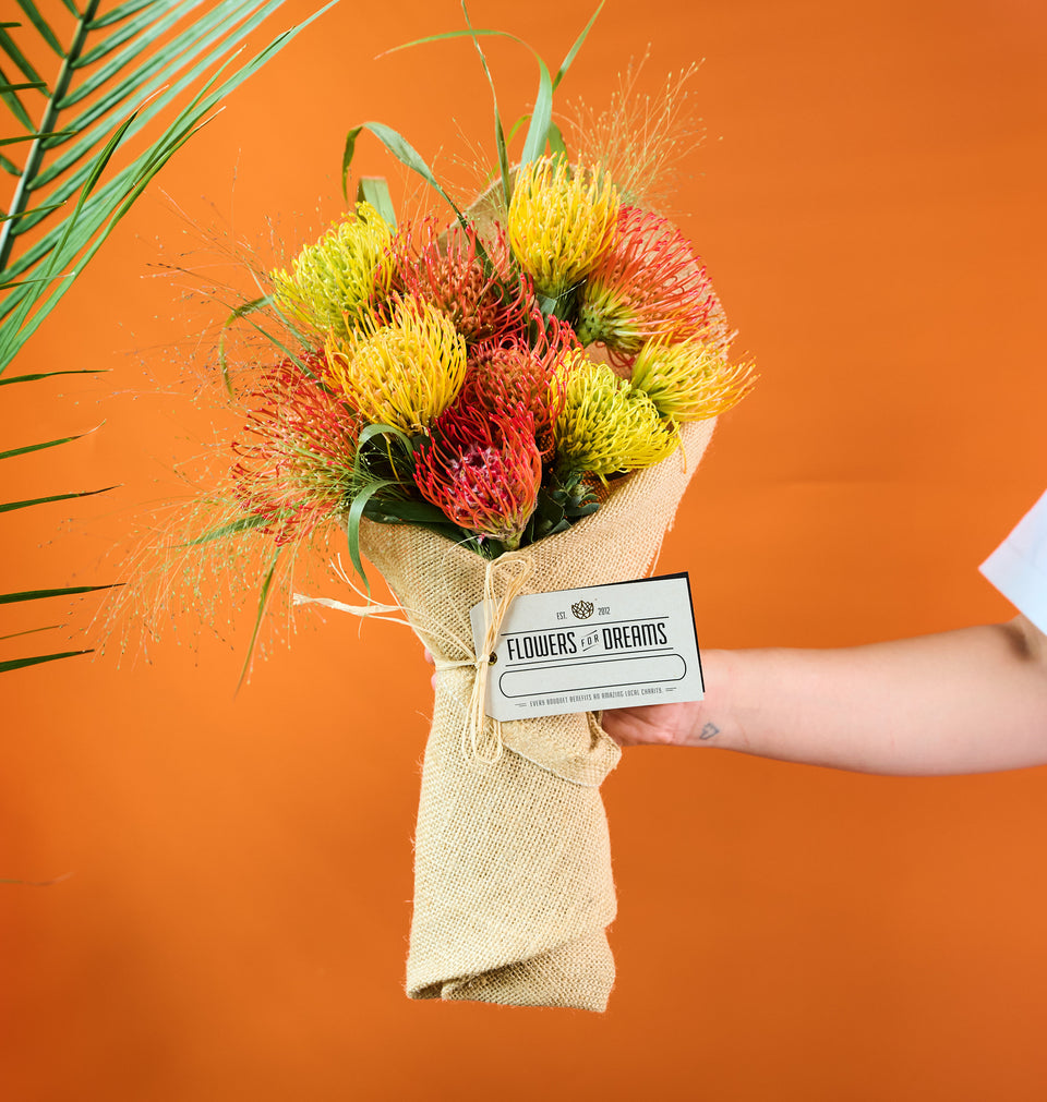 Pincushion protea bouquet with bold textured blooms