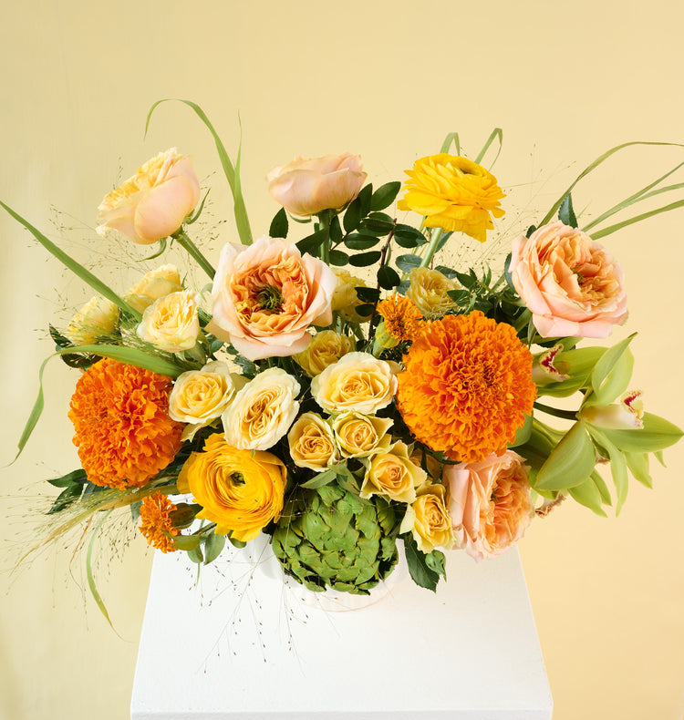 Large Clementine bouquet in an urn vase, vibrant coral flowers