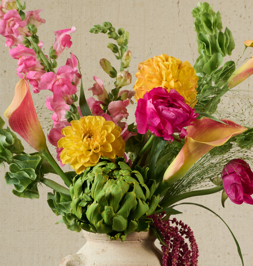 Double bunch Artisan bouquet in jug close-up, lush mixed flowers