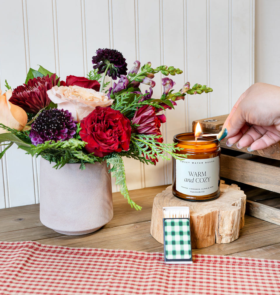 Send our The Cozy Candle Set bouquet of flowers to someone