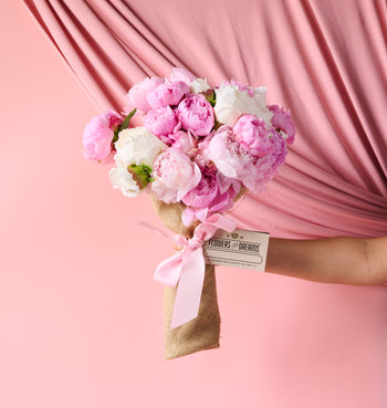 Lush blush and coral peonies arranged for romantic Mother’s Day flower delivery in Chicago, Detroit, and Milwaukee.