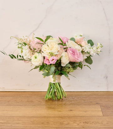 Lush blush and ivory wedding flowers for elegant arrangements.